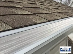 Completed GutterDome installation on a home with comp shingle roofing and siding