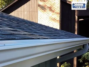Seamless gutter with downspout installation